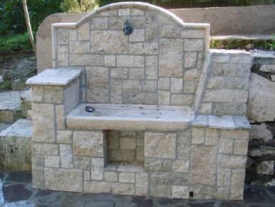 Fountain in draft of travertine